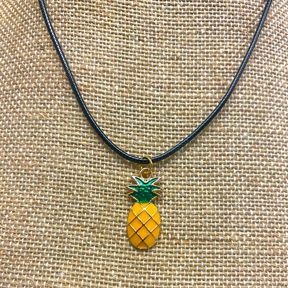 Cute pineapple necklace on leather wax cord with hook enclosure.